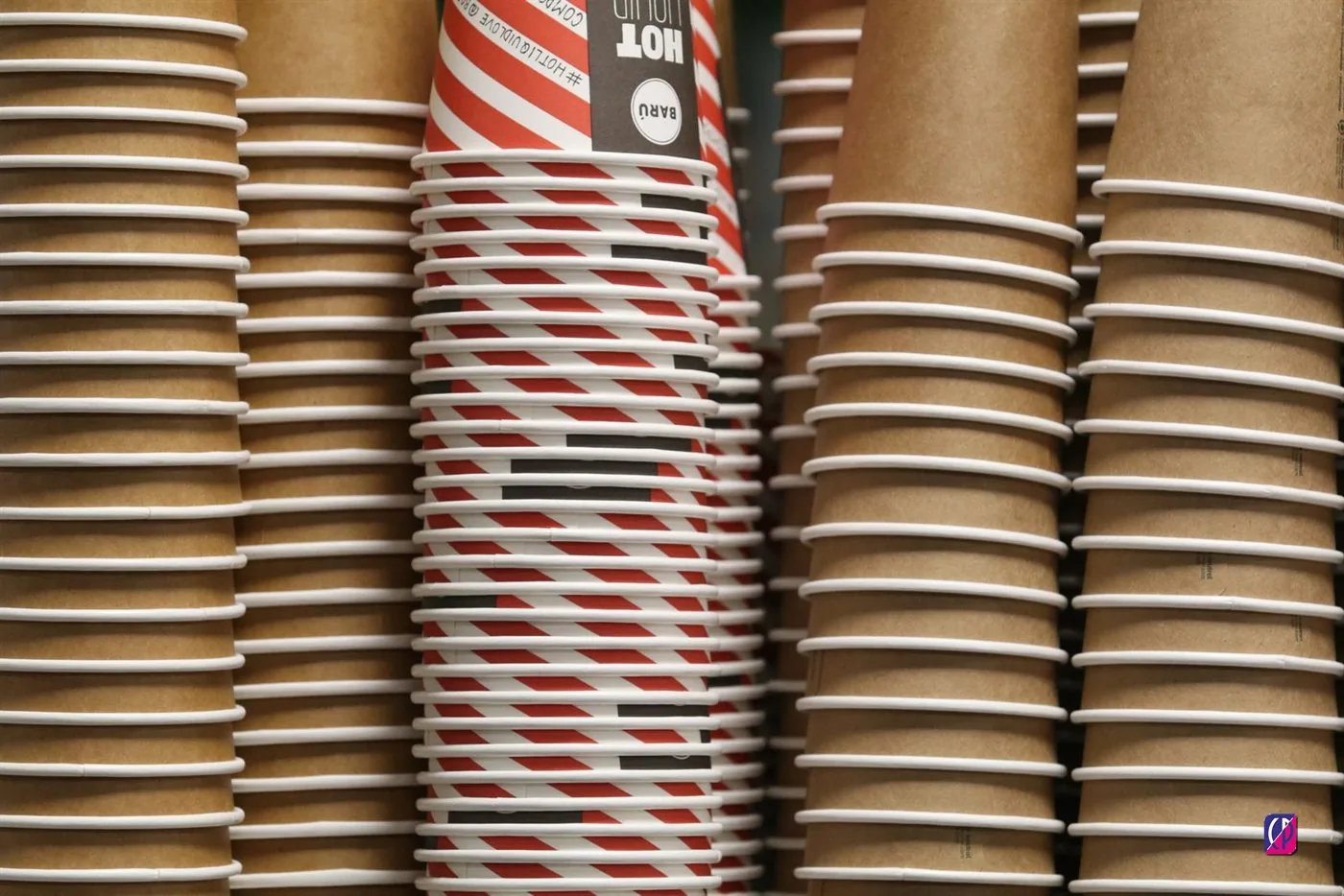 Stacked packaging supplies showing a mix of paper and plastic formats